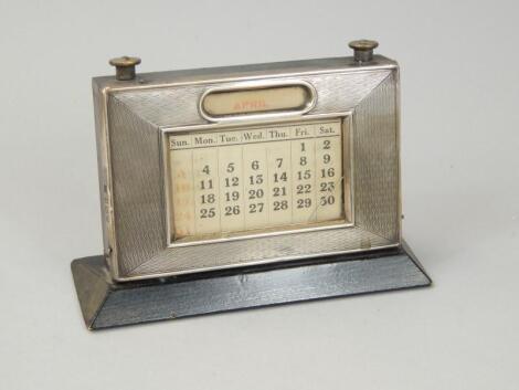 An Elizabeth II silver mounted desk calendar