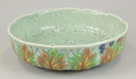 A Clarice Cliff salad drainer