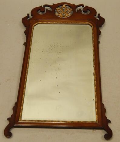 A mahogany fret framed wall mirror