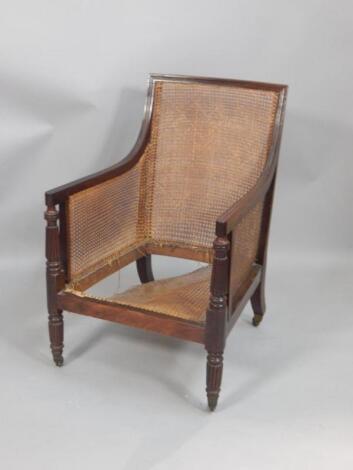 A George IV mahogany bergere armchair