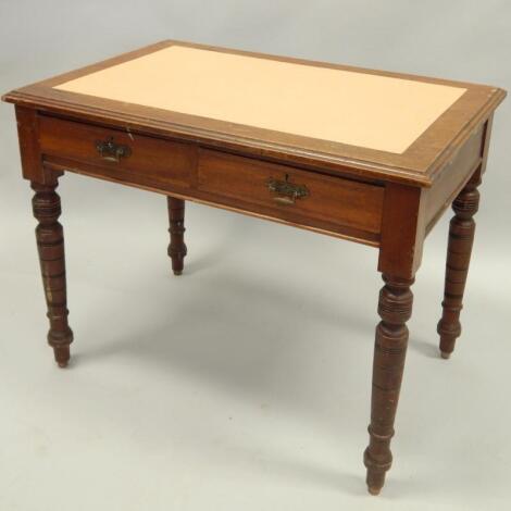 A Victorian walnut writing table