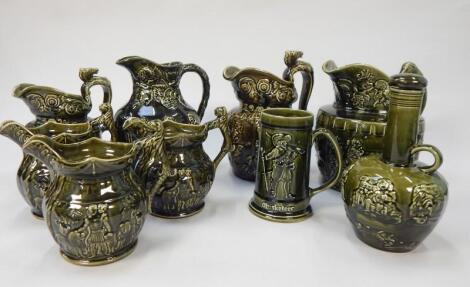 A collection of Woods relief moulded jugs