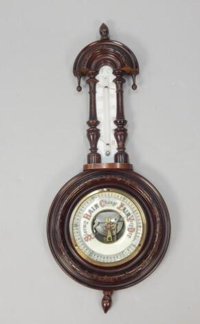 A late 19thC walnut aneroid barometer/thermometer