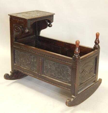 A 19thC carved oak child's crib