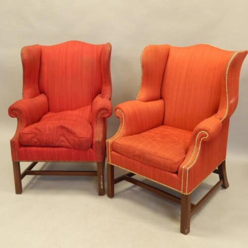 A pair of George III style mahogany wing back chairs