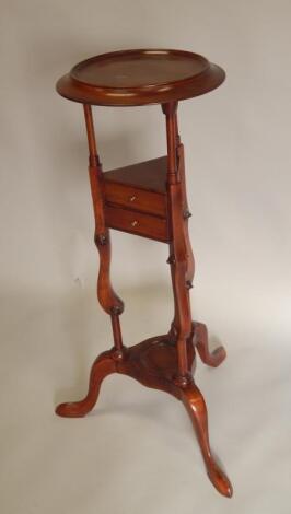 A reproduction mahogany wash stand