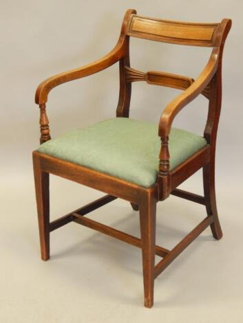 An early 19thC mahogany open armchair