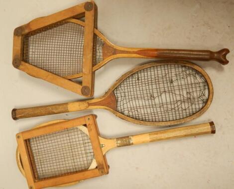 Three vintage tennis rackets