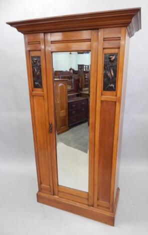 A late Victorian pale walnut wardrobe