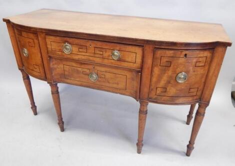 An early 19thC mahogany and ebony strung bow fronted sideboard