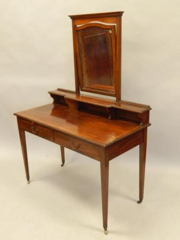 An Edwardian mahogany and satinwood crossbanded dressing table