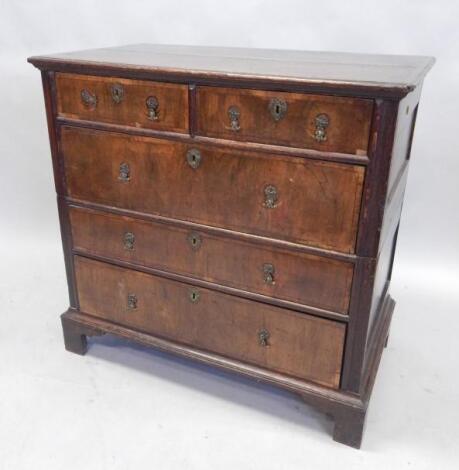 An 18thC oak and walnut chest of drawers