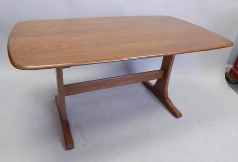 An Ercol type elm kitchen table