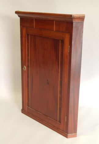 A 19thC mahogany and chequer banded corner cabinet