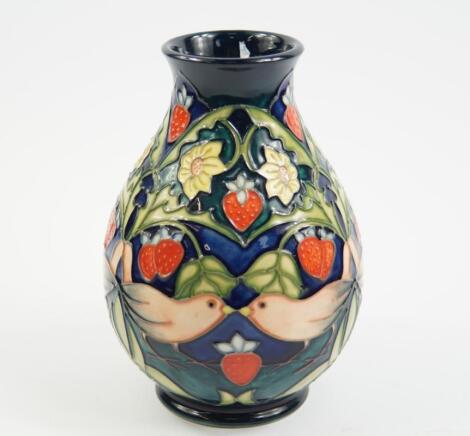 A Moorcroft Pottery vase decorated in The Strawberry Thief pattern