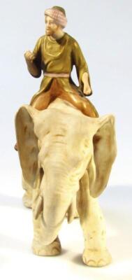 A 19thC bisque porcelain figure of a gentleman riding an elephant - 3