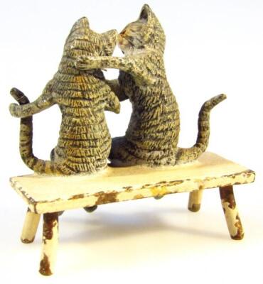 An early 20thC cold painted bronze humorous figure of two kittens on a bench - 2