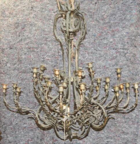 A 19thC gilt wrought brass candelabra with cut glass droplets