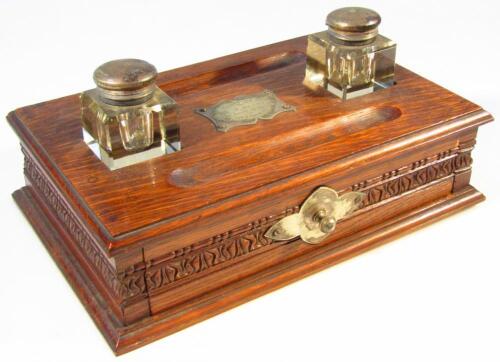 An Edwardian oak desk stand