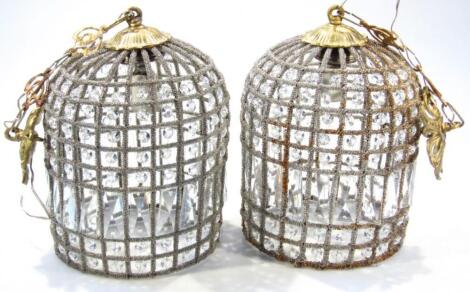 A pair of highly decorative light shade lanterns