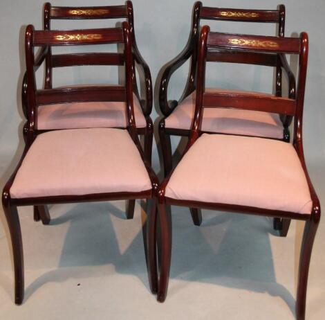 A set of four Regency style dining chairs