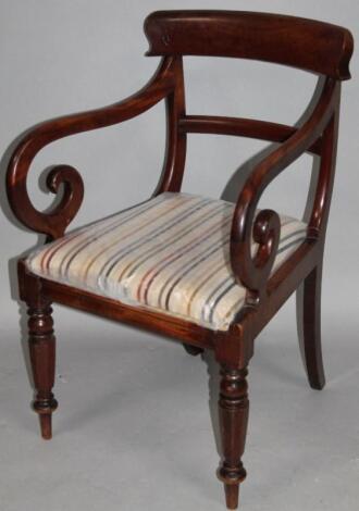 An early 19thC mahogany carver chair