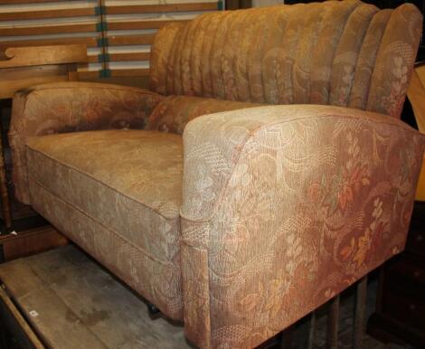 A 1930's shell back two seater settee