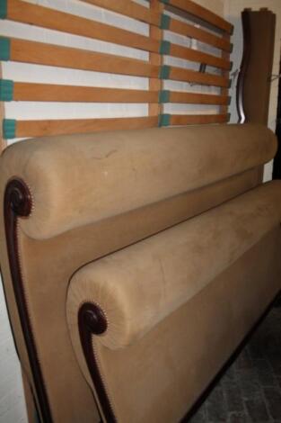 A Victorian mahogany and over stuffed sleigh style bed