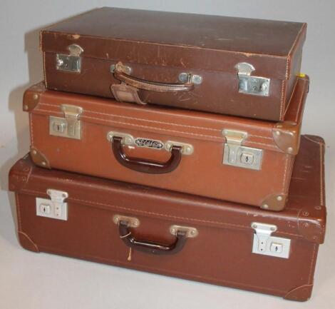 Various travel cases comprising a brown leather example