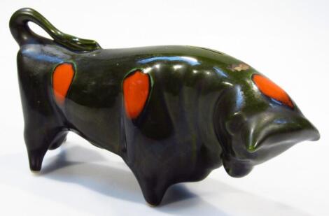 A modern Italian Bitossi style pottery figure group of a bull money box