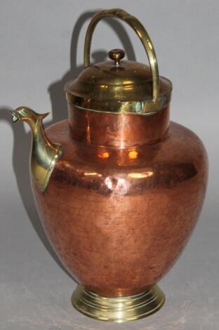 An early 20thC copper and brass vessel