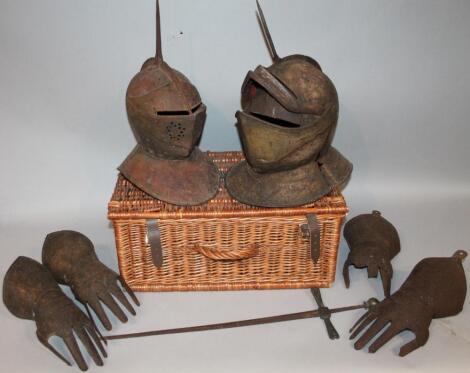 Various armour, to include helmets, gauntlet guards, etc., contained in a F & M wicker hamper (a quantity)