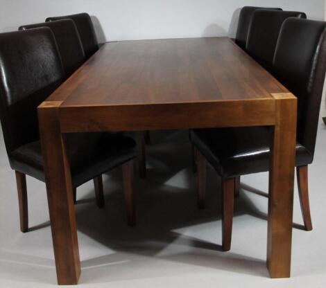 A modern hardwood table and six chairs