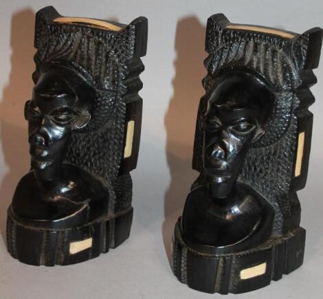 A pair of African tribal ebonised hardwood bookends