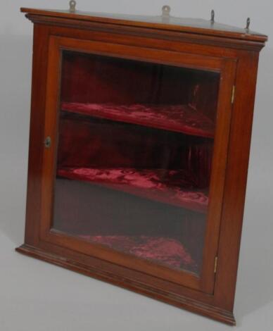 An early 20thC mahogany hanging corner cupboard