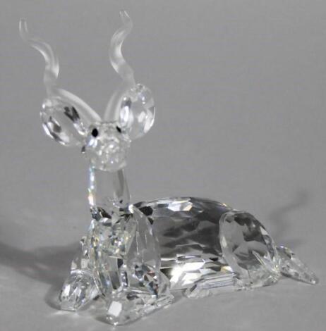 A Swarovski crystal figure of a recumbent stag