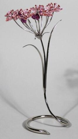 A Swarovski crystal floral group on entwined plated stem