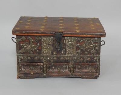 An Indian hardwood box with brass studded and overlaid decoration