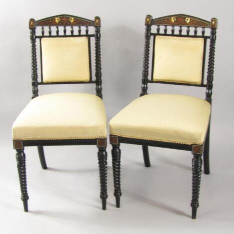 A pair of Victorian ebonised single dining chairs