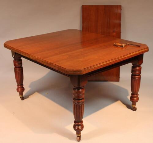 A late Victorian walnut dining table