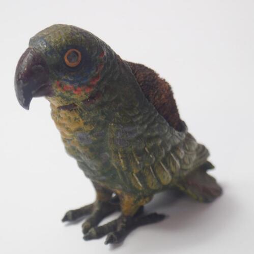 An early 20thC cold painted figure of a parrot