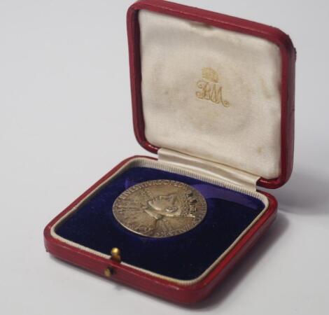 A silver commemorative medallion for the Investiture of Edward as Prince of Wales 1911