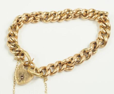 A yellow metal curb link bracelet