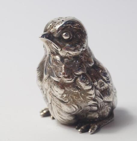 A Continental late 19thC silver pepperette modelled as a chick