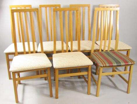 A set of seven oak single dining chairs