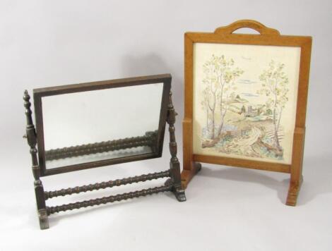 An Edwardian oak swing frame toilet mirror