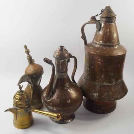 Middle Eastern brass and copper lidded jugs and coffee pots