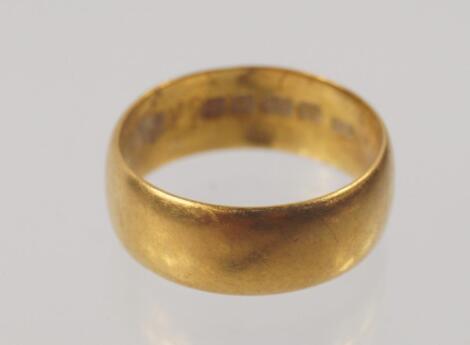 A 22ct gold broad wedding band