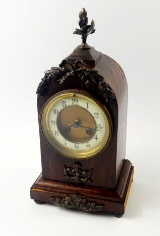 A French late 19thC walnut and brass mounted mantel clock