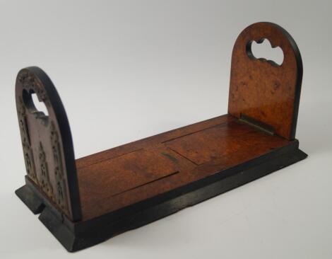 A Victorian walnut and ebonised book slide